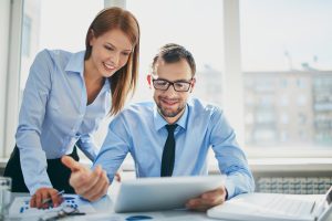 Image of two successful business partners working at meeting in Image of two successful business partners working at meeting in